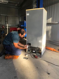 An AA King Refrigeration mechanic testing that fridge repairs conducted have been effective