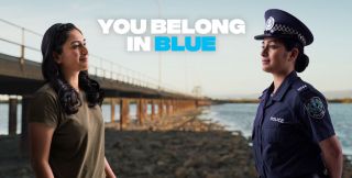 You Belong in Blue with a female in plain clothes mirrored by her proud self in police uniform