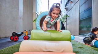 Child playing on equipment at Filnders Street